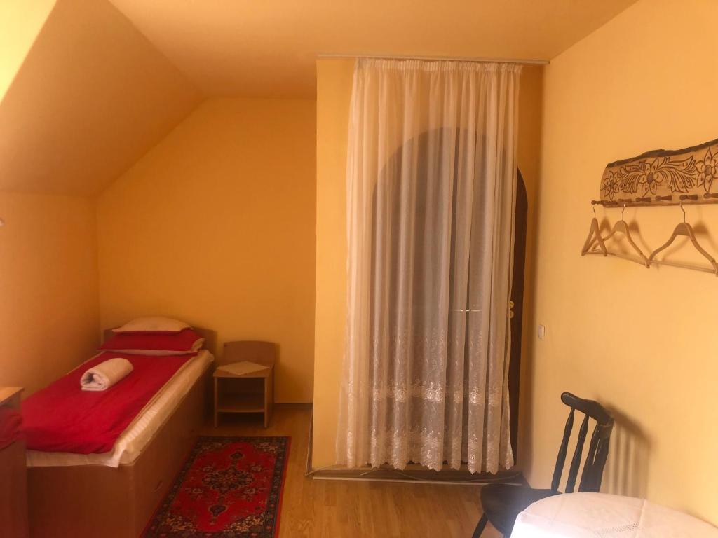 Postel nebo postele na pokoji v ubytování Tünde Vendégház
