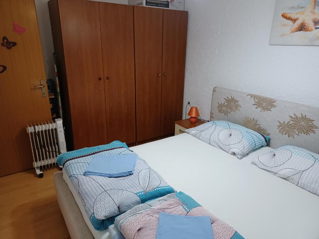 Posteľ alebo postele v izbe v ubytovaní Apartments Zuanović