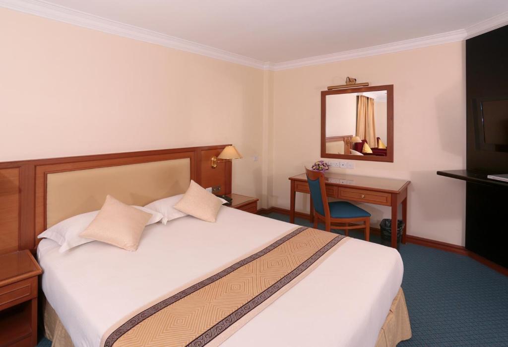 Postel nebo postele na pokoji v ubytování Hotel Sentosa