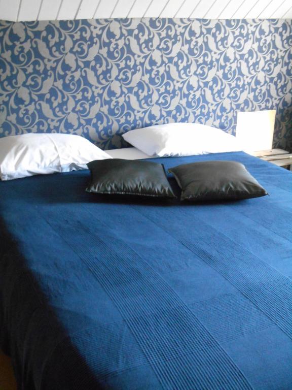 Postel nebo postele na pokoji v ubytování B&B A l'Ombre du Tilleul