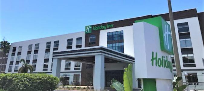 a building with a hilton sign in front of it at Holiday Inn - Tampa North, an IHG Hotel in Tampa