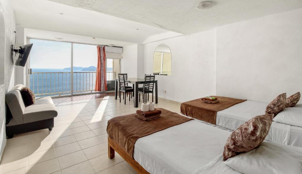 Postel nebo postele na pokoji v ubytování Suites Torres Gemelas VIP