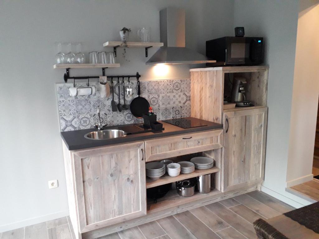 Kuchyň nebo kuchyňský kout v ubytování Het Innerhof