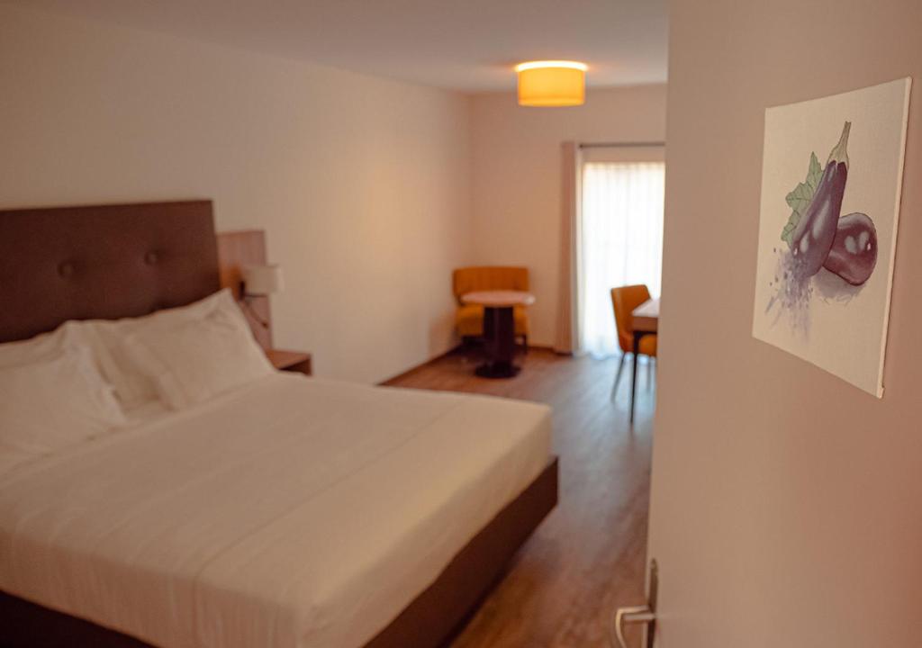 Postel nebo postele na pokoji v ubytování Auberge Le Relais