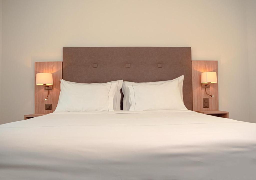 Postel nebo postele na pokoji v ubytování Auberge Le Relais