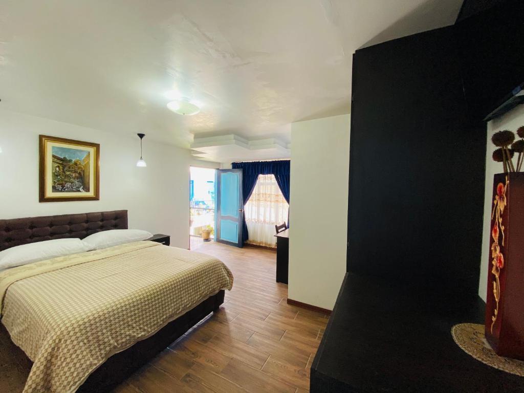 Postel nebo postele na pokoji v ubytování Hotel Montecarlo