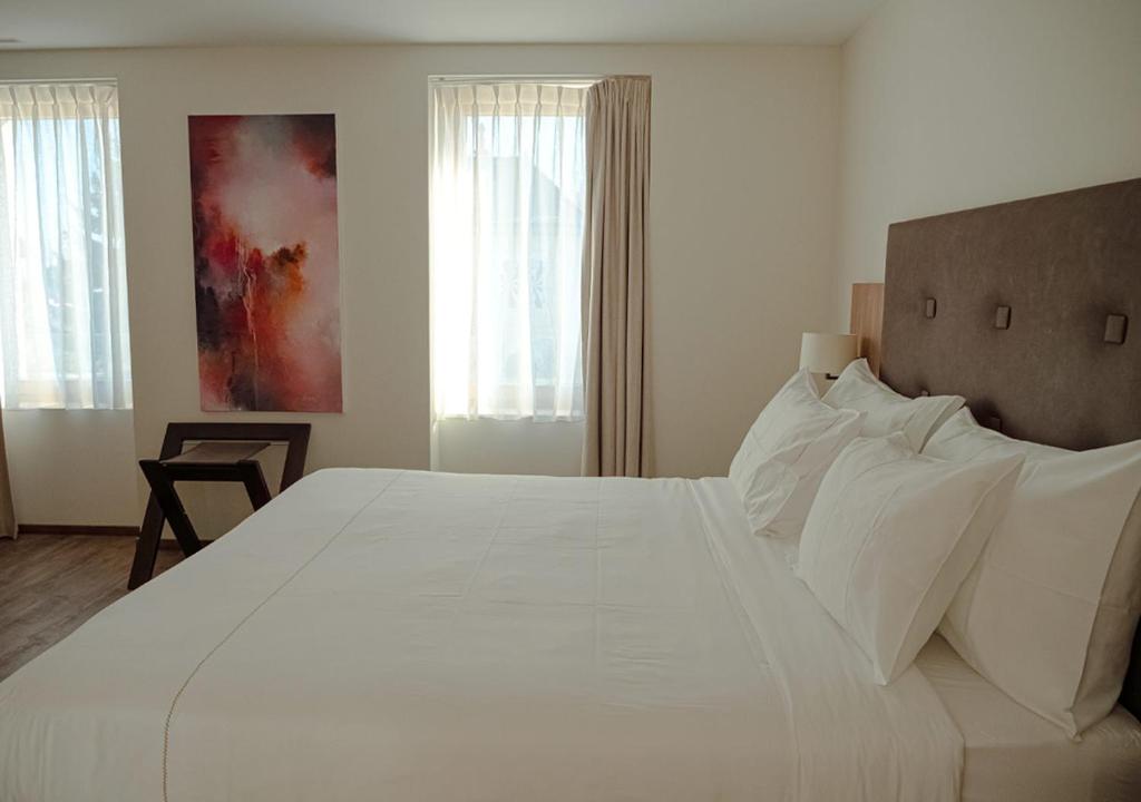 Postel nebo postele na pokoji v ubytování Auberge Le Relais
