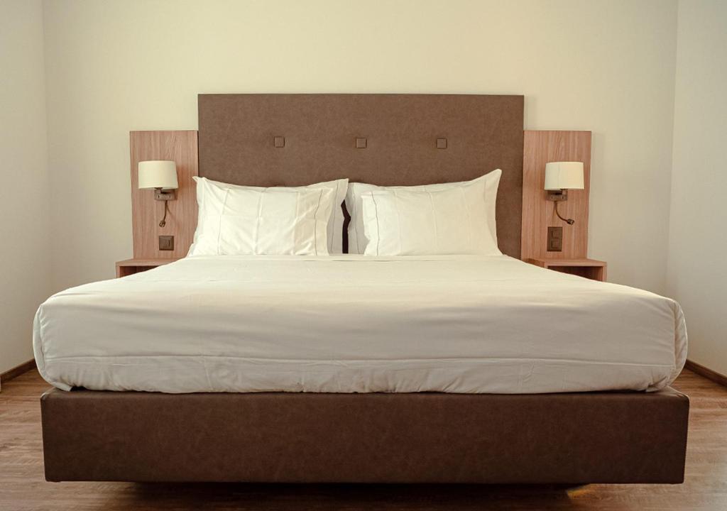 Postel nebo postele na pokoji v ubytování Auberge Le Relais