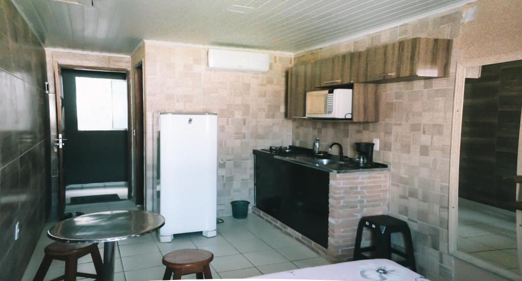 A cozinha ou cozinha compacta de STUDIO Ponta Verde