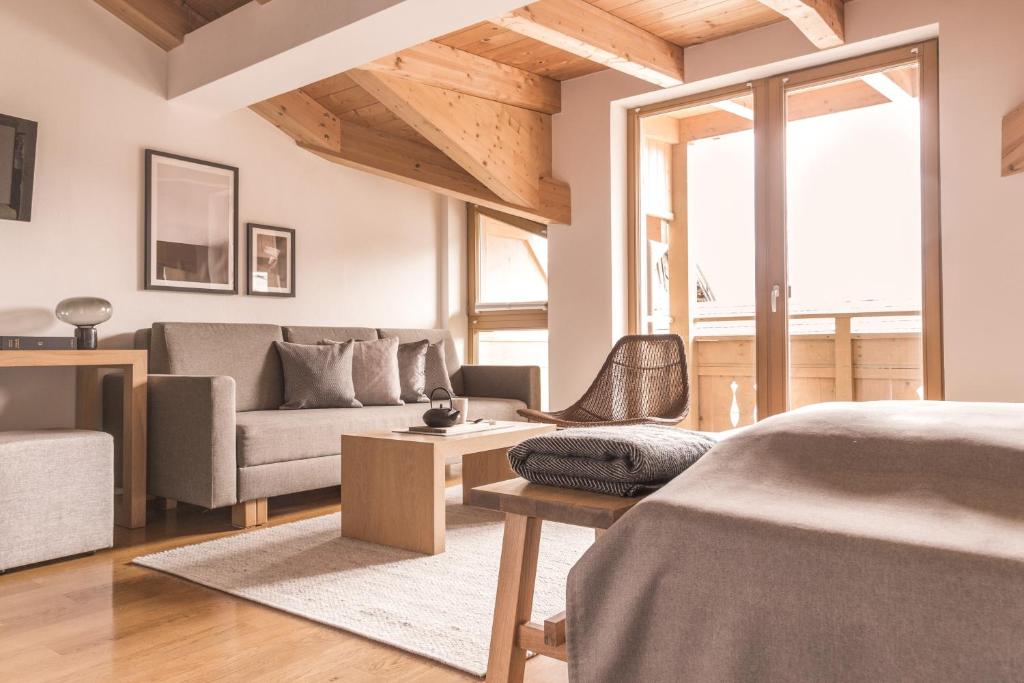 Postel nebo postele na pokoji v ubytování GEBHARD Boutique B&B inklusive Sommercard