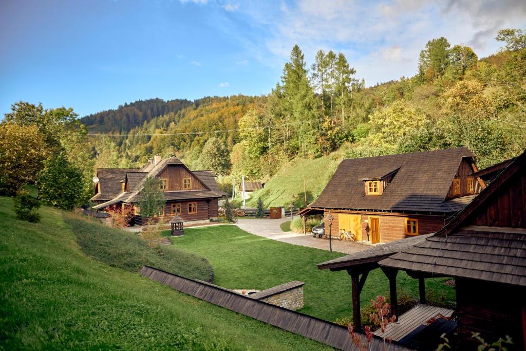 a group of houses with a grass roof at Chalupy Mátěráda in Karolinka