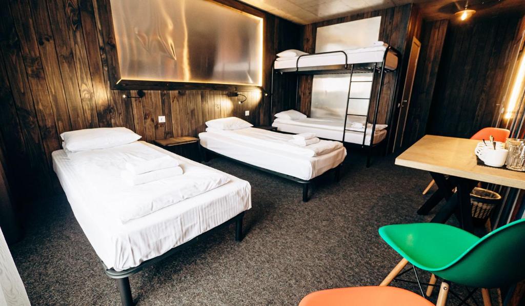 Postel nebo postele na pokoji v ubytování Loft Hotel