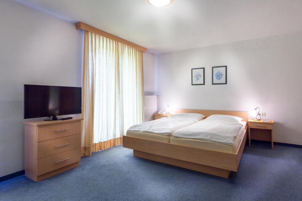 Postel nebo postele na pokoji v ubytování Pension Gstrein
