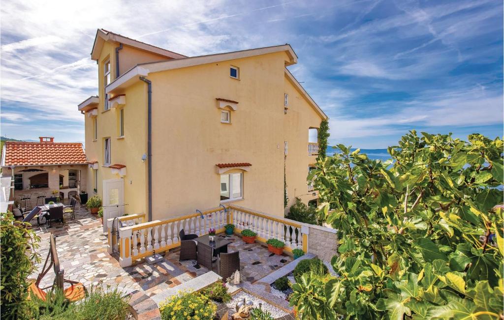 an image of a house with a patio at Cozy Apartment In Crikvenica With Wifi in Crikvenica