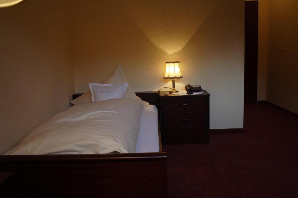 Postel nebo postele na pokoji v ubytování Hotel Graf Balduin