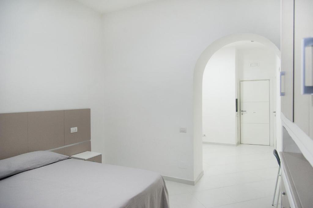 Łóżko lub łóżka w pokoju w obiekcie Hotel Regina