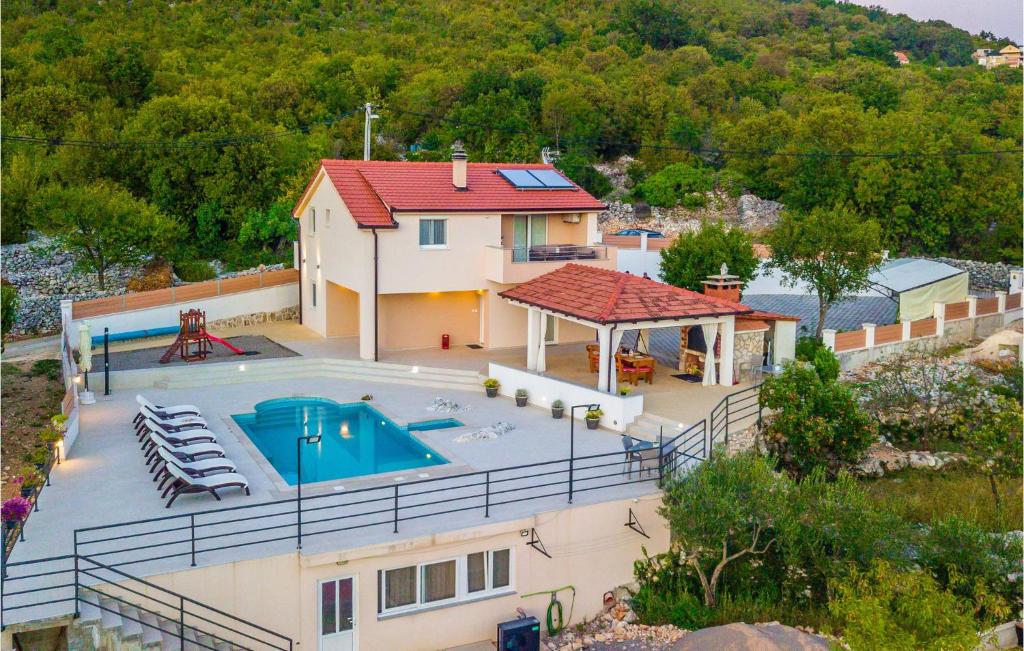 an aerial view of a house with a swimming pool at Cozy Home In Nova Sela With Outdoor Swimming Pool in Nova Sela