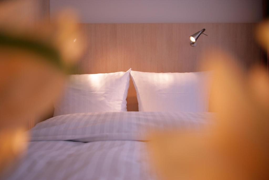 Postel nebo postele na pokoji v ubytování Hotel Senator München