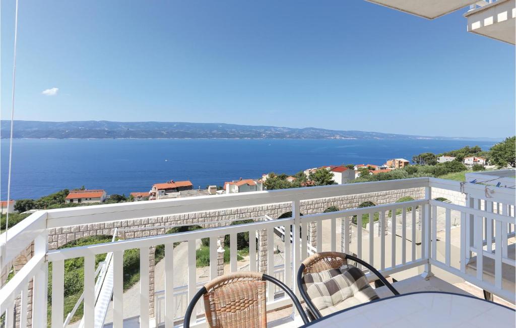 a balcony with a view of the water at Nice Apartment In Stanici With 2 Bedrooms And Wifi in Tice