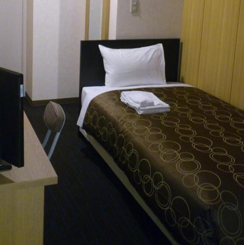 Postel nebo postele na pokoji v ubytování Select Inn Hamamatsu Ekimae