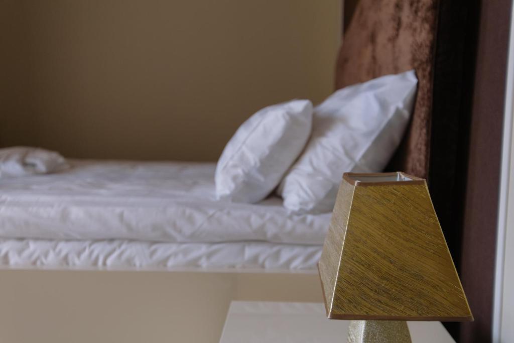 Postel nebo postele na pokoji v ubytování Hotel Ankavi