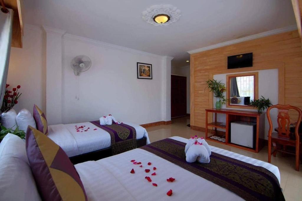 Postel nebo postele na pokoji v ubytování Bou Phanith Villa