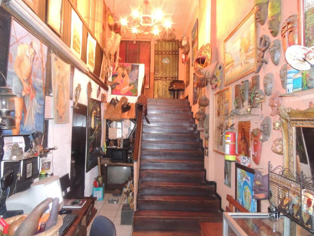 a stairway in a room with a bunch of stuff at Hostal del Este Santa Fe in San José
