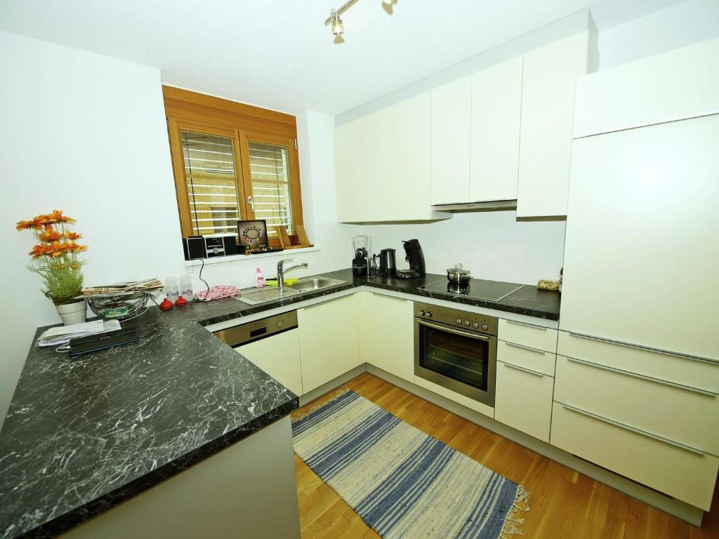 A kitchen or kitchenette at Apartment at the ski lift in Brand in Vorarlberg