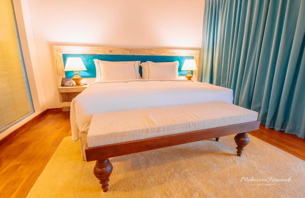 Postel nebo postele na pokoji v ubytování The Villas, Wadduwa
