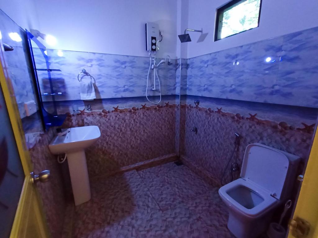 Koupelna v ubytování Sigiri Tarushan Home Stay