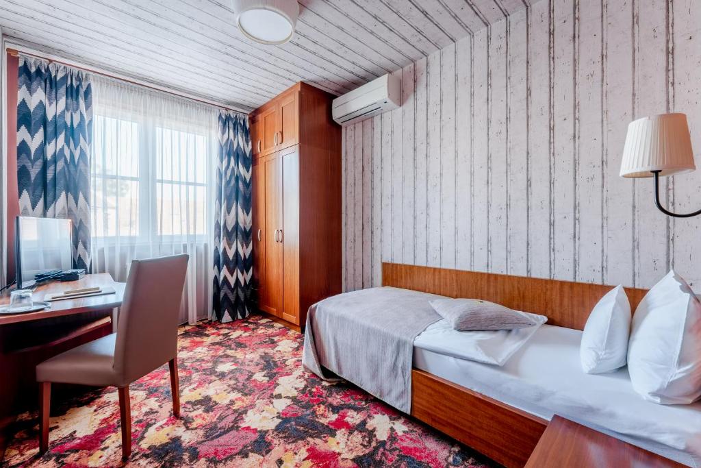 Posteľ alebo postele v izbe v ubytovaní Hotel Lajta Park
