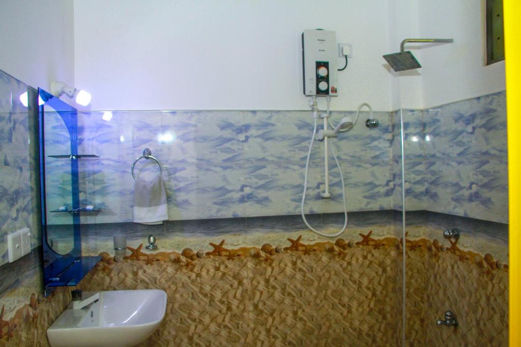 Koupelna v ubytování Sigiri Tarushan Home Stay