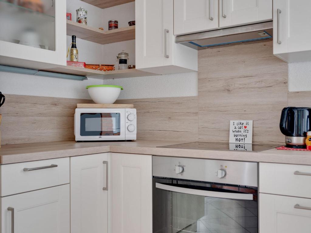 A kitchen or kitchenette at Riverside Apartment in Oed-Öhling
