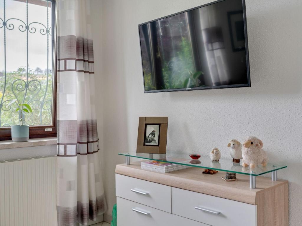 A television and/or entertainment centre at Riverside Apartment in Oed-Öhling