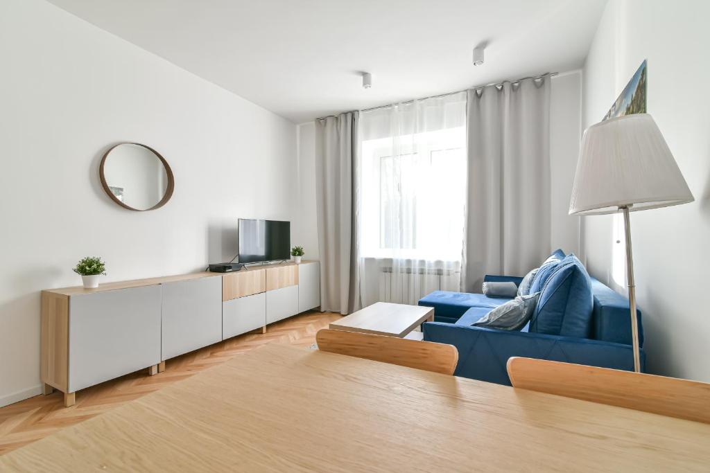 Televízia a/alebo spoločenská miestnosť v ubytovaní LTC - Apartments Piłsudskiego przy Bulwarze
