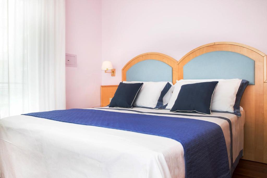 Łóżko lub łóżka w pokoju w obiekcie Hotel Parco