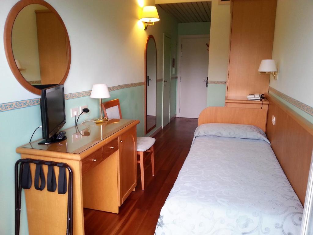 Łóżko lub łóżka w pokoju w obiekcie Hotel Parco