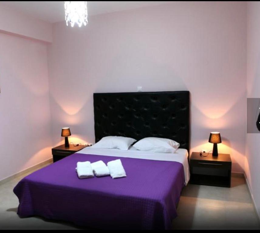 Posteľ alebo postele v izbe v ubytovaní Spilios Apartment