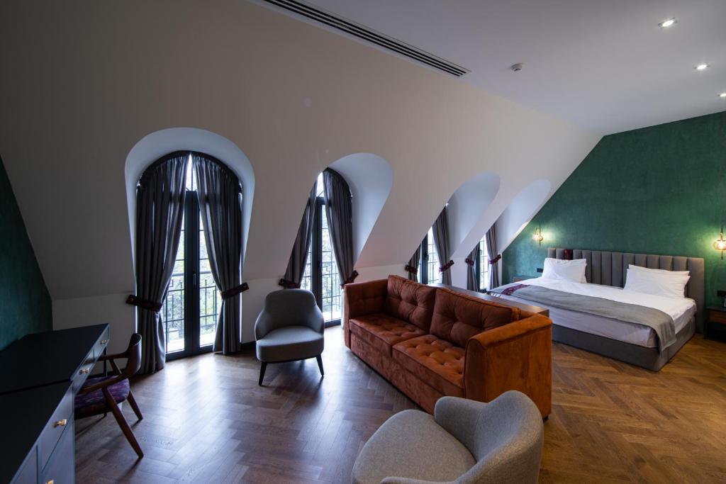 Postel nebo postele na pokoji v ubytování Molokan Inn Hotel