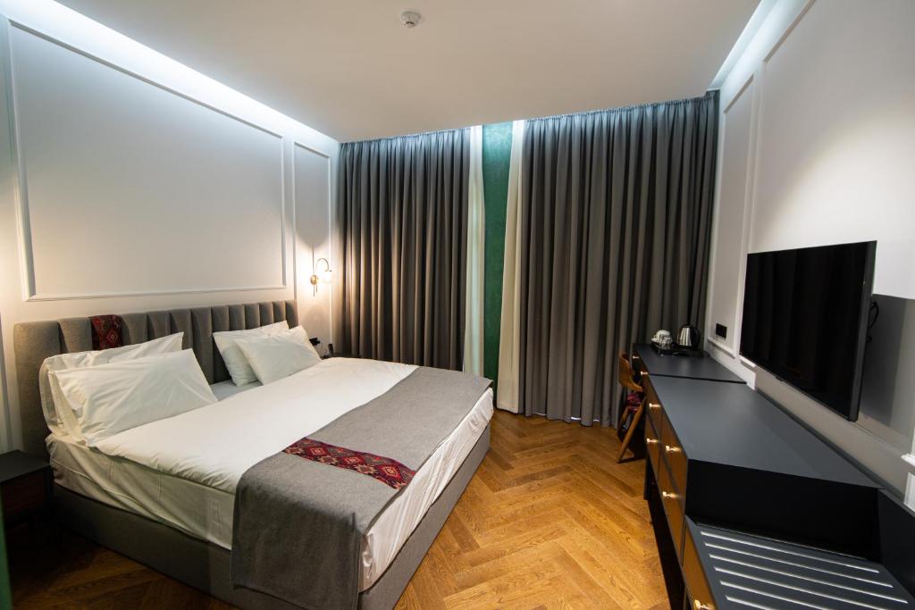 TV a/nebo společenská místnost v ubytování Molokan Inn Hotel