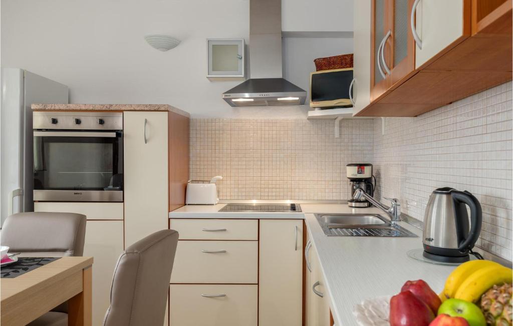 Kuchyň nebo kuchyňský kout v ubytování Apartment Zbandaj V