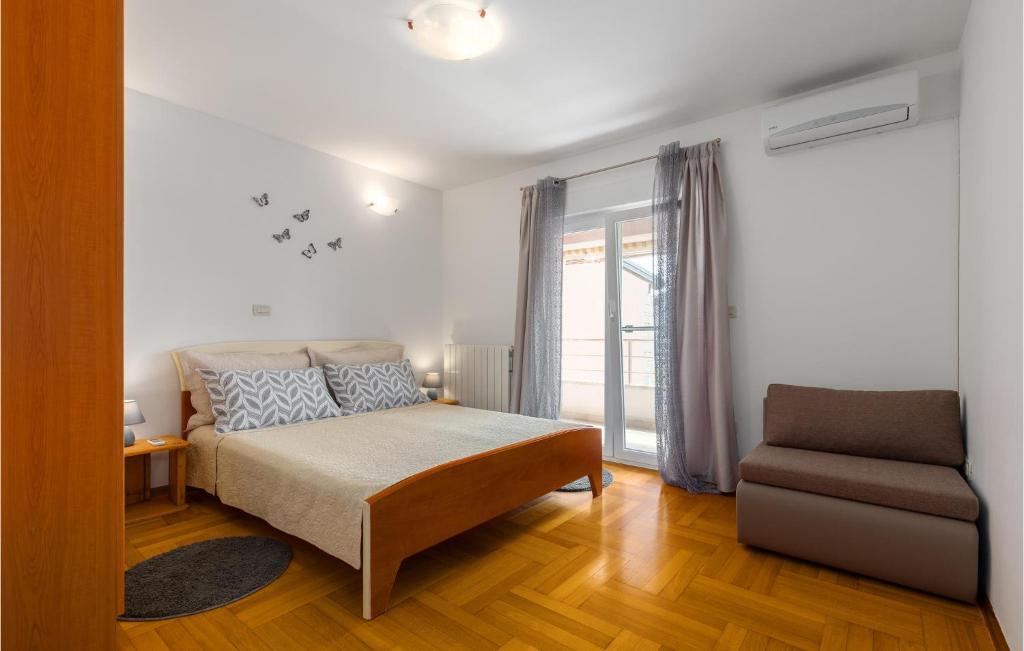Postel nebo postele na pokoji v ubytování Apartment Zbandaj V