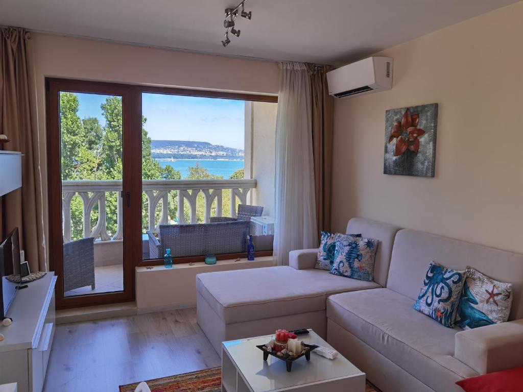 A seating area at By the Waves luxury beach apartment