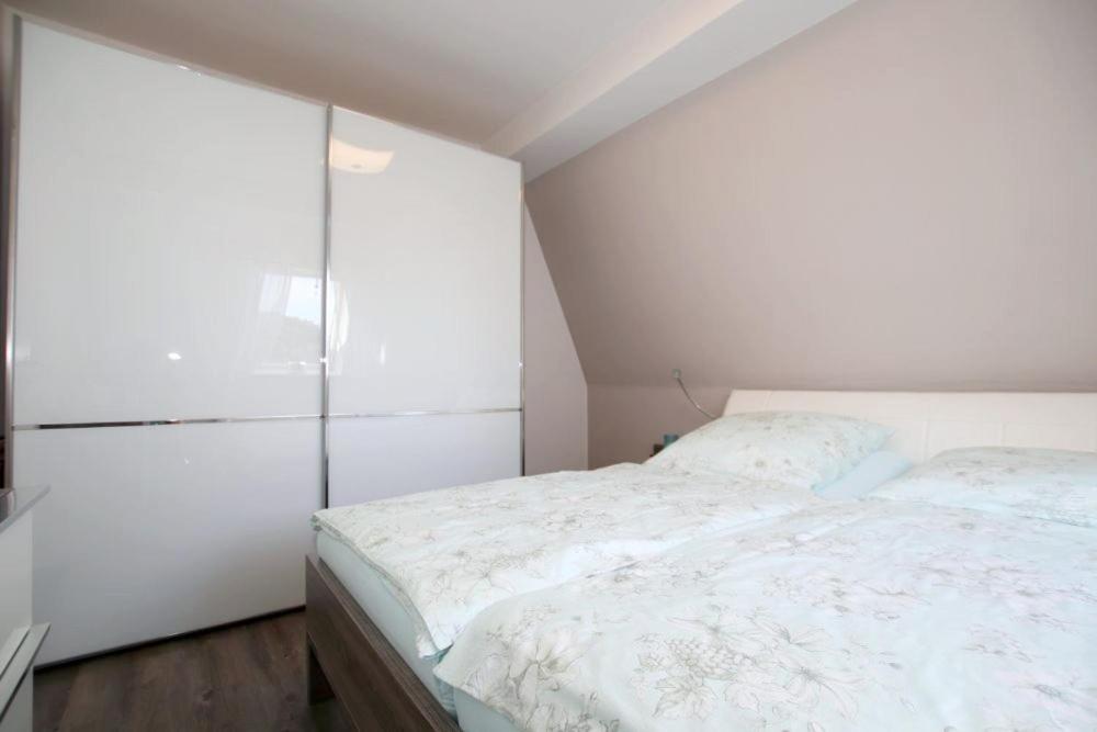 Postel nebo postele na pokoji v ubytování Ankerplatz Niendorf