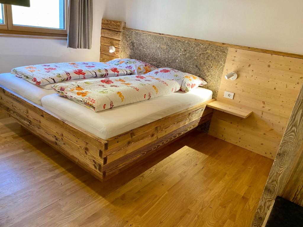 Postel nebo postele na pokoji v ubytování Schmalzlhof