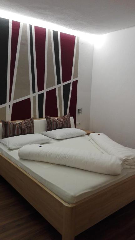 Postel nebo postele na pokoji v ubytování Garni Brunnenhof