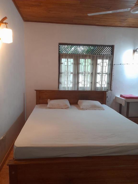 Postel nebo postele na pokoji v ubytování Ceylon Casa