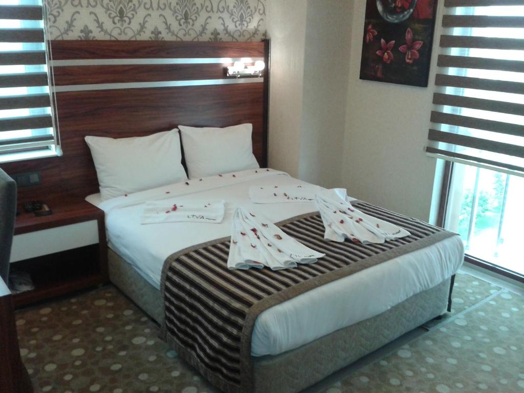 A bed or beds in a room at My Liva Hotel