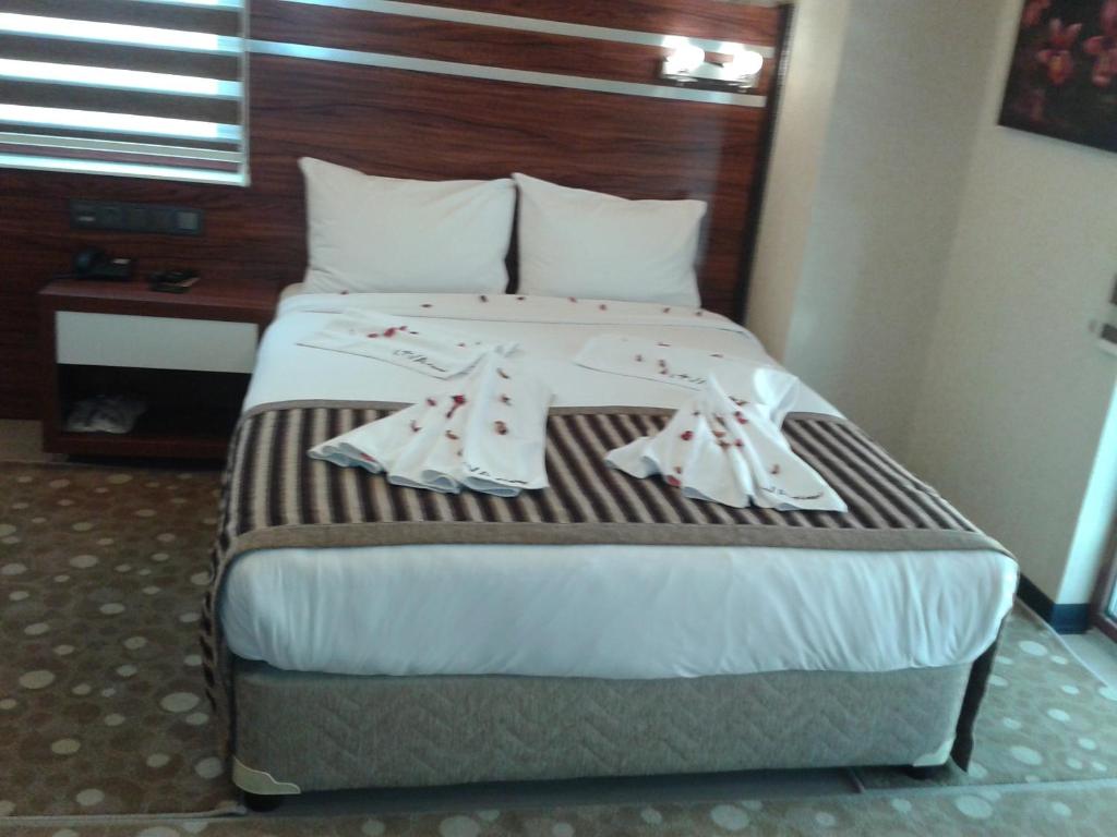 A bed or beds in a room at My Liva Hotel