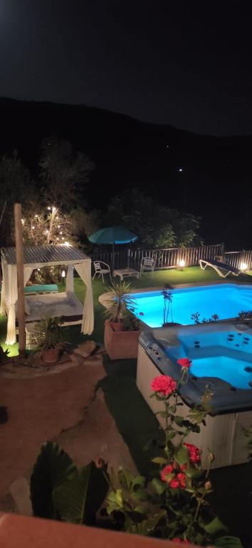 a view of a swimming pool at night at Casa Molina in Alcaucín